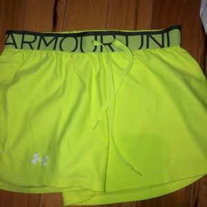 Neon green running shorts, lightly worn